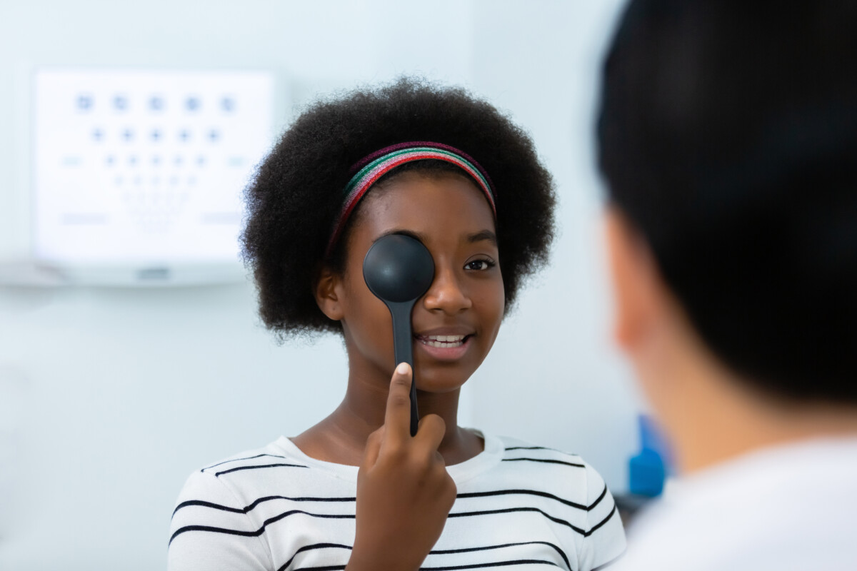 Young Woman African American Using Occluder For Eye Test Ophthal